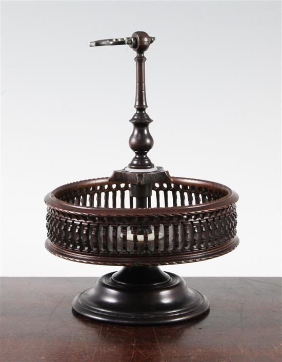 A Georgian style brass mounted turned and pierced lignum vitae cruet stand, H.9.5in.